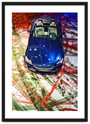 Framed image of a BMW Roadster viewed from above front, parked on top of the artwork created by painting the wheels and driving on a canvas